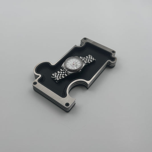 Steel vanity tray with watch on white background