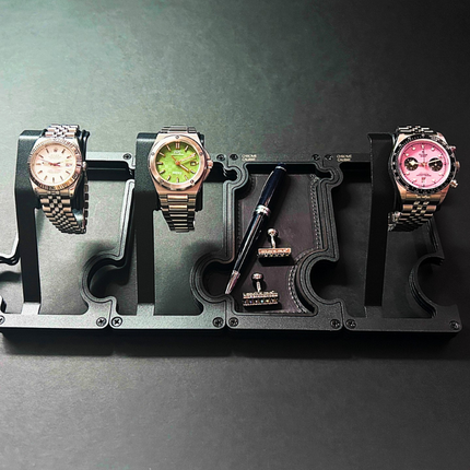 Chrome Calibre Puzzle Watch Stand and Tray in Obsidian finish displaying a watch on a desk setup