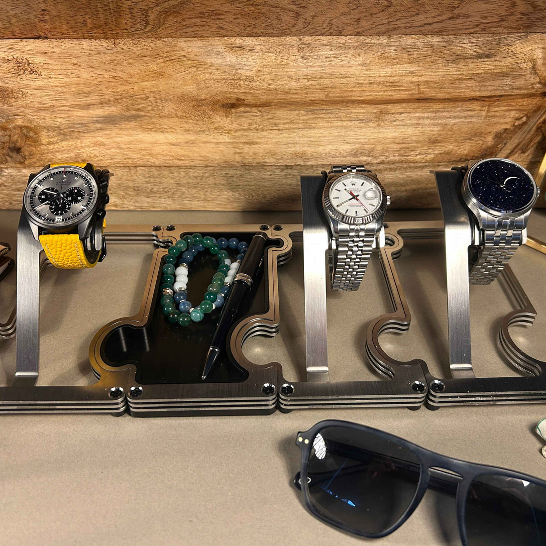 Puzzle Stands with wood background and sunglasses in foreground