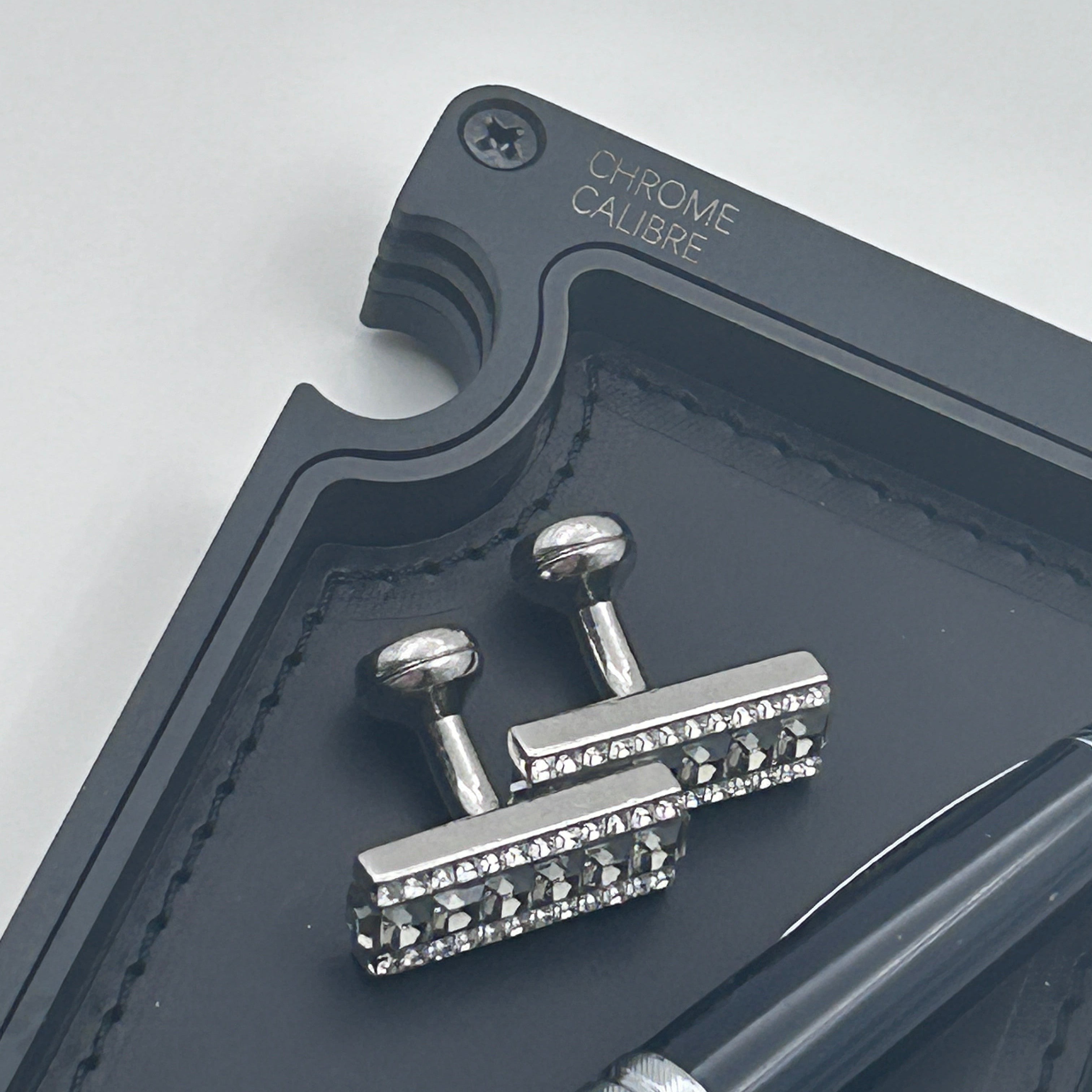 Close up image of corner of vanity tray on white background