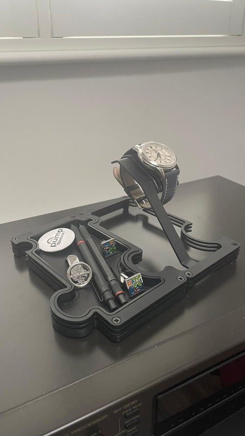 Watches on a display stand with a neutral background