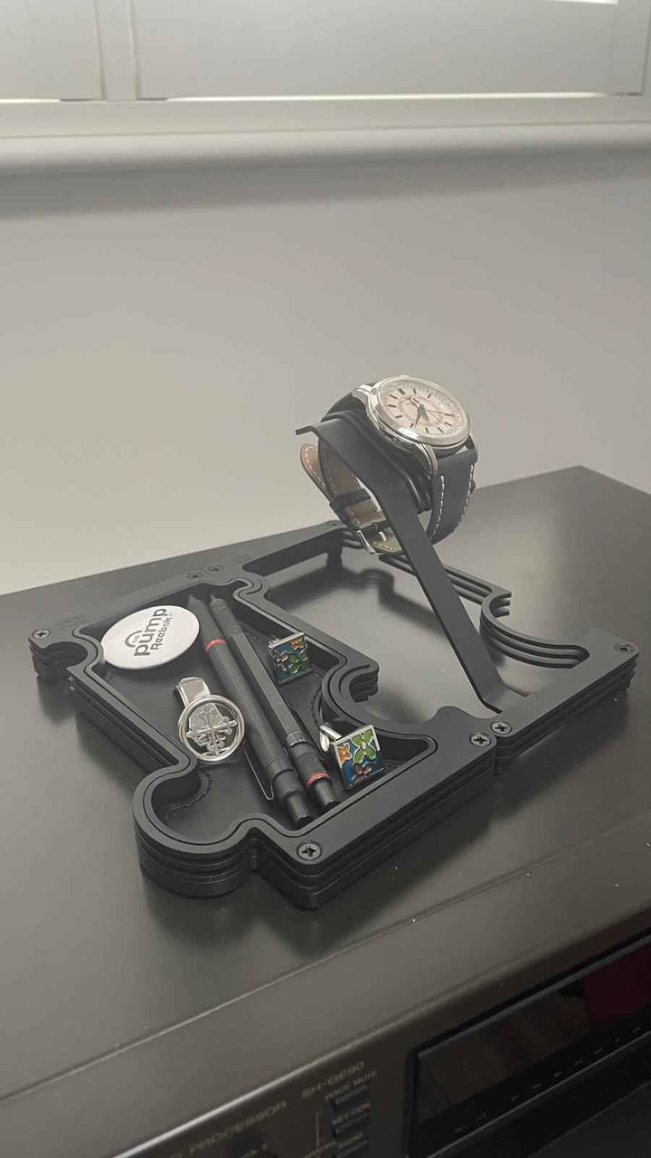 Watches on a display stand with a neutral background