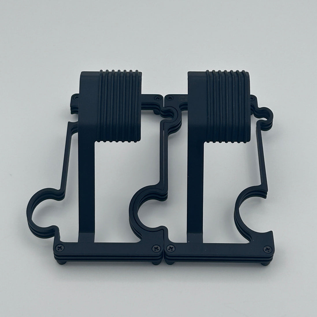 2 Black Matt watch stands on a white background