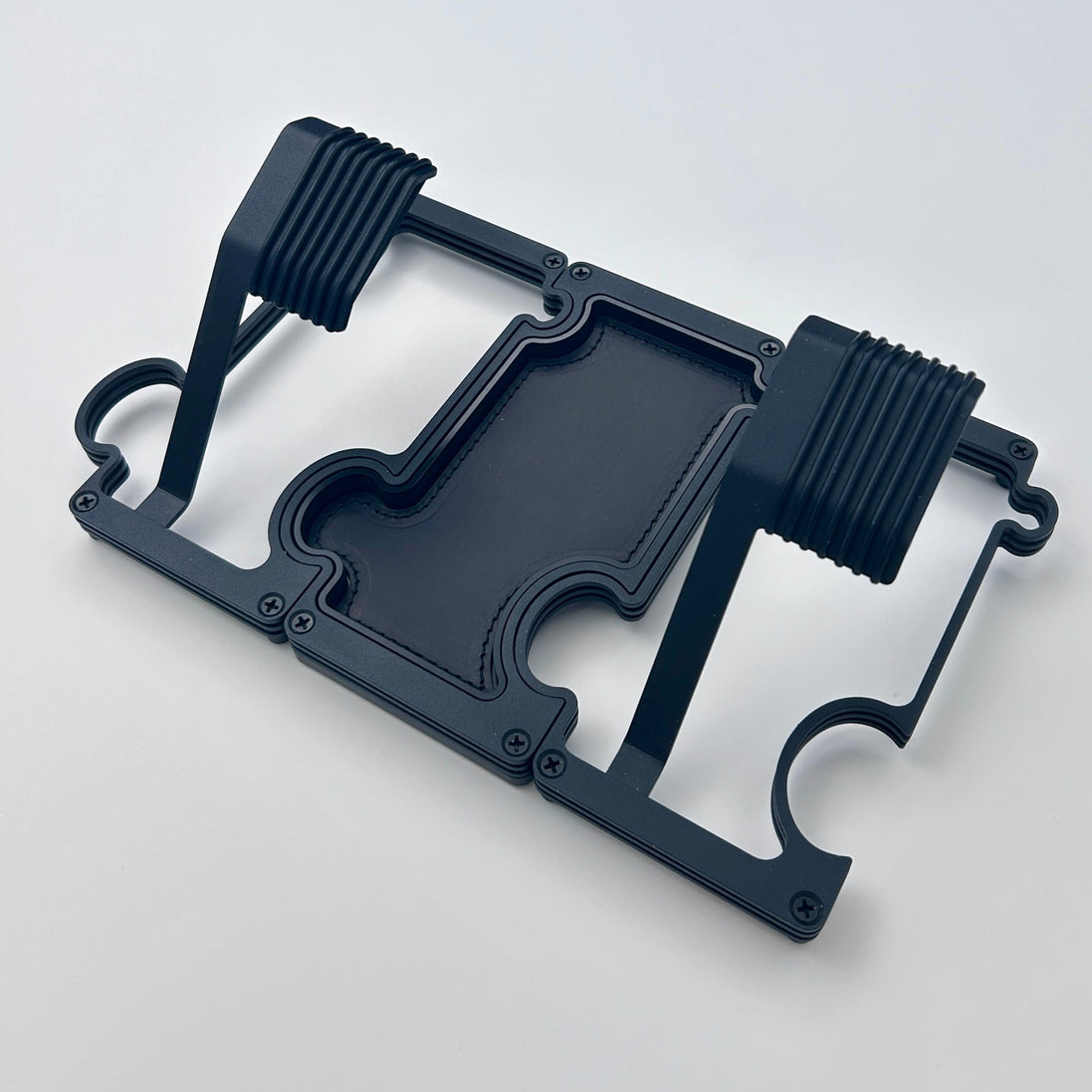 Black layered metal watch stand set with 2 stands and a vanity tray linked together.