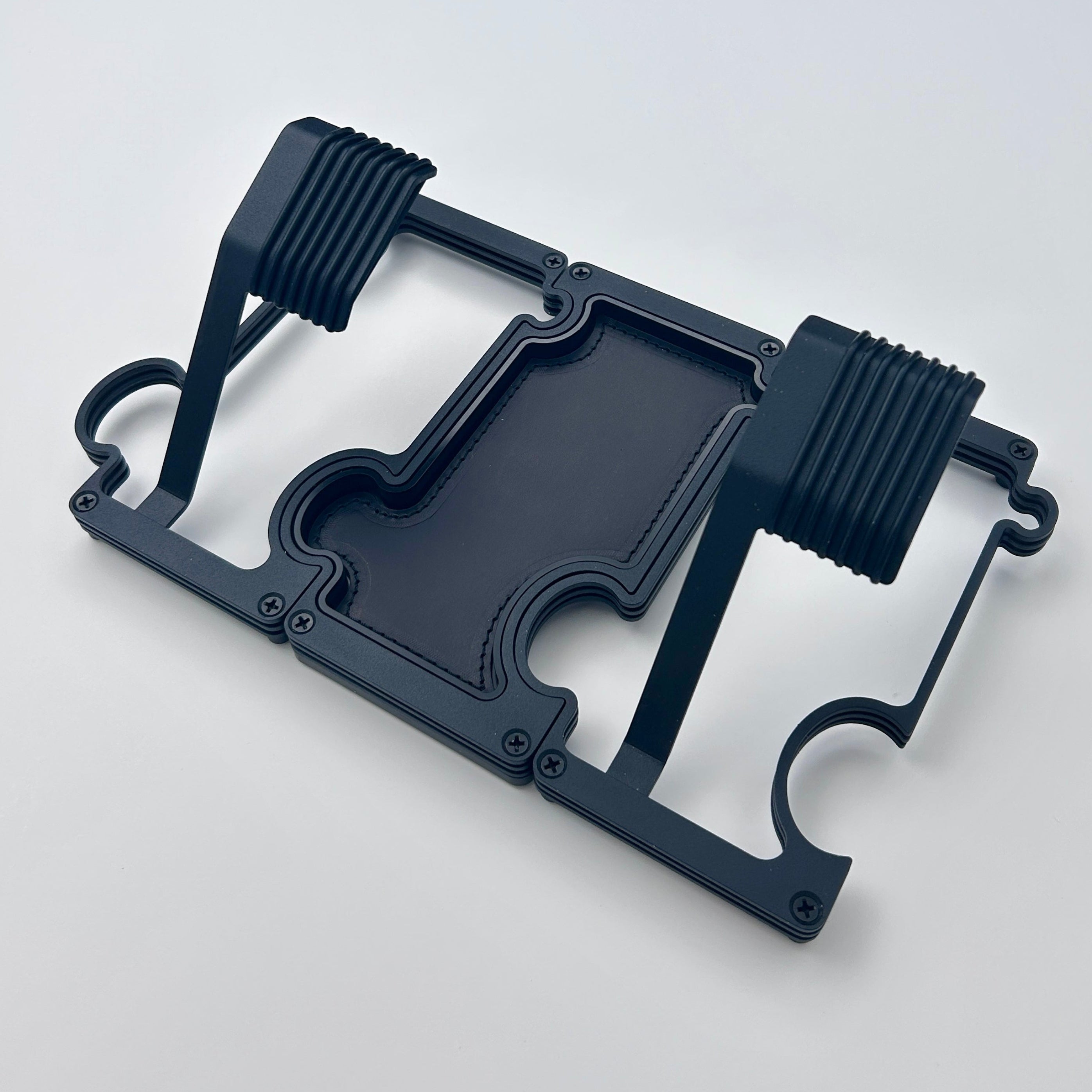 Black layered metal watch stand set with 2 stands and a vanity tray linked together.