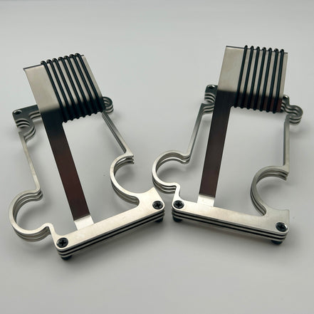 2 Puzzle watch stands side by side in brushed steel