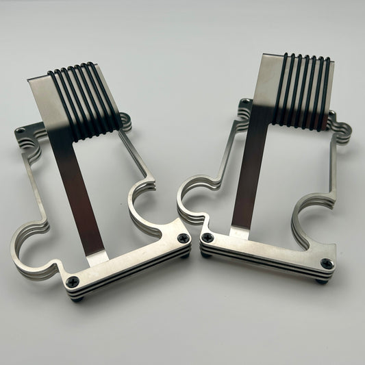 2 Puzzle watch stands side by side in brushed steel