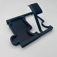 A black watch stand and vanity tray set on a white background