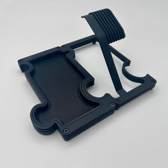 A black watch stand and vanity tray set on a white background