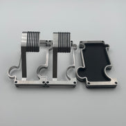 2 puzzle shaped watch stands interlinked and a separate puzzle shaped vanity tray beside them on a white backround