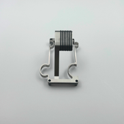 Metallic watch stand on a light gray background