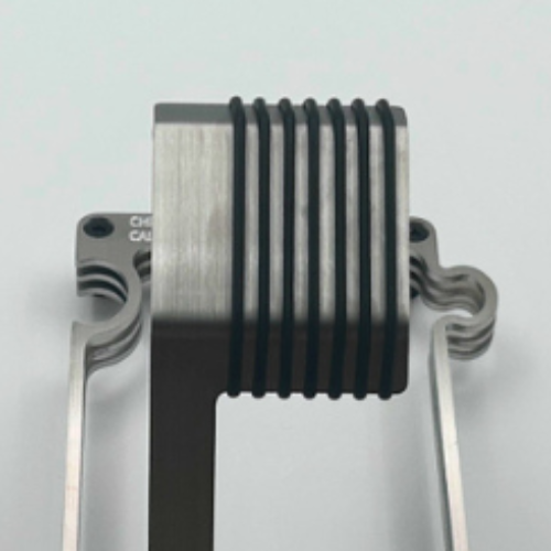 Metallic Watch Stand Closeup on a light gray background