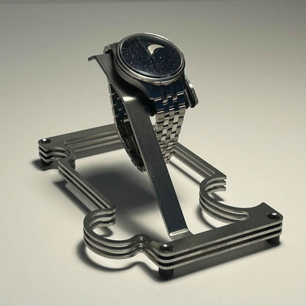 Puzzle Stand in brushed steel with moonphase watch