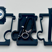 Three watch stands with watches on a white background