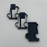 2 black metal watch stands and a black vanity tray on a white background