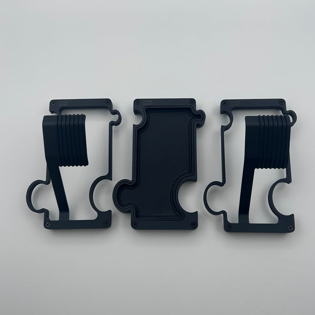 2 black watch stands and one black bvanity tray on white background