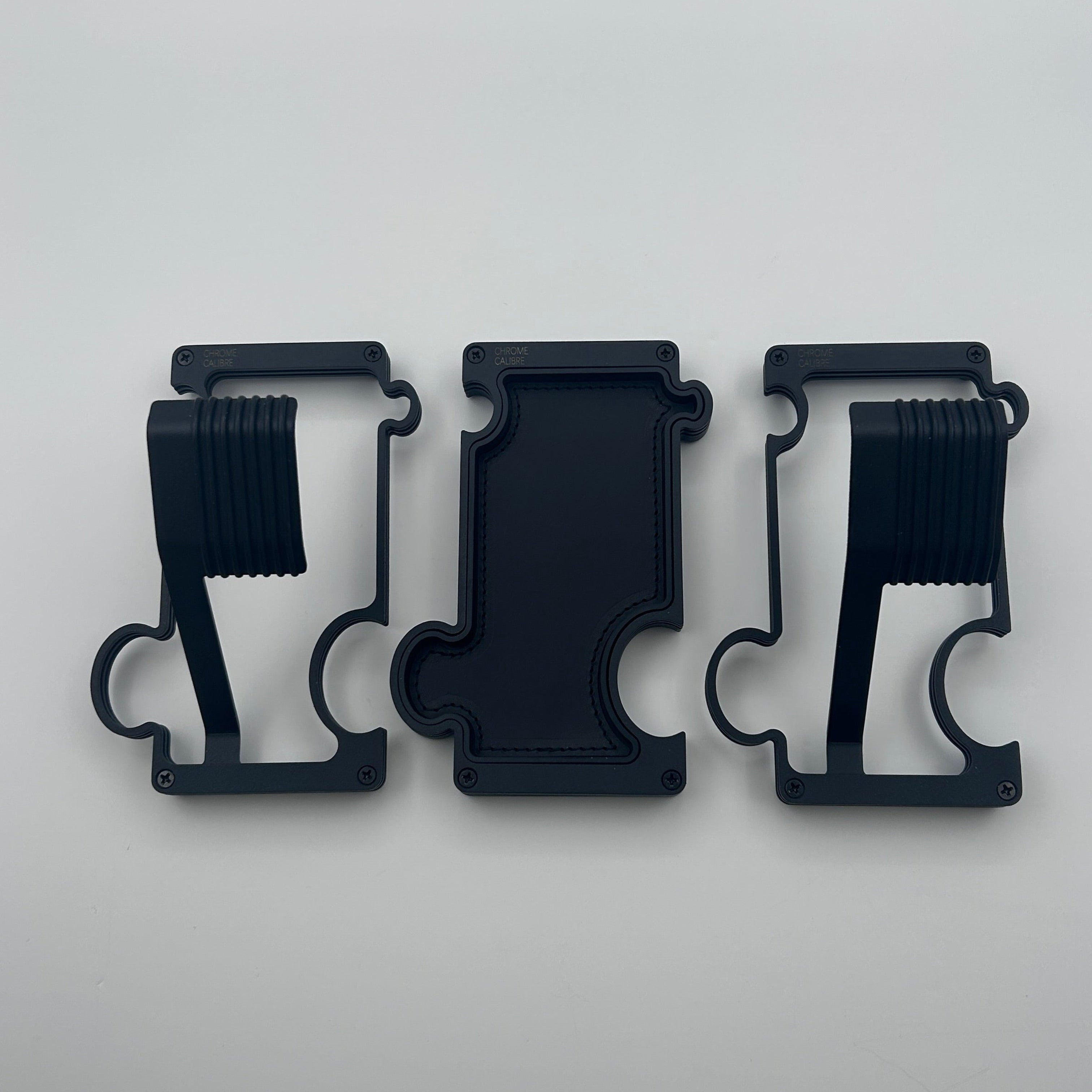 2 black watch stands and one black bvanity tray on white background