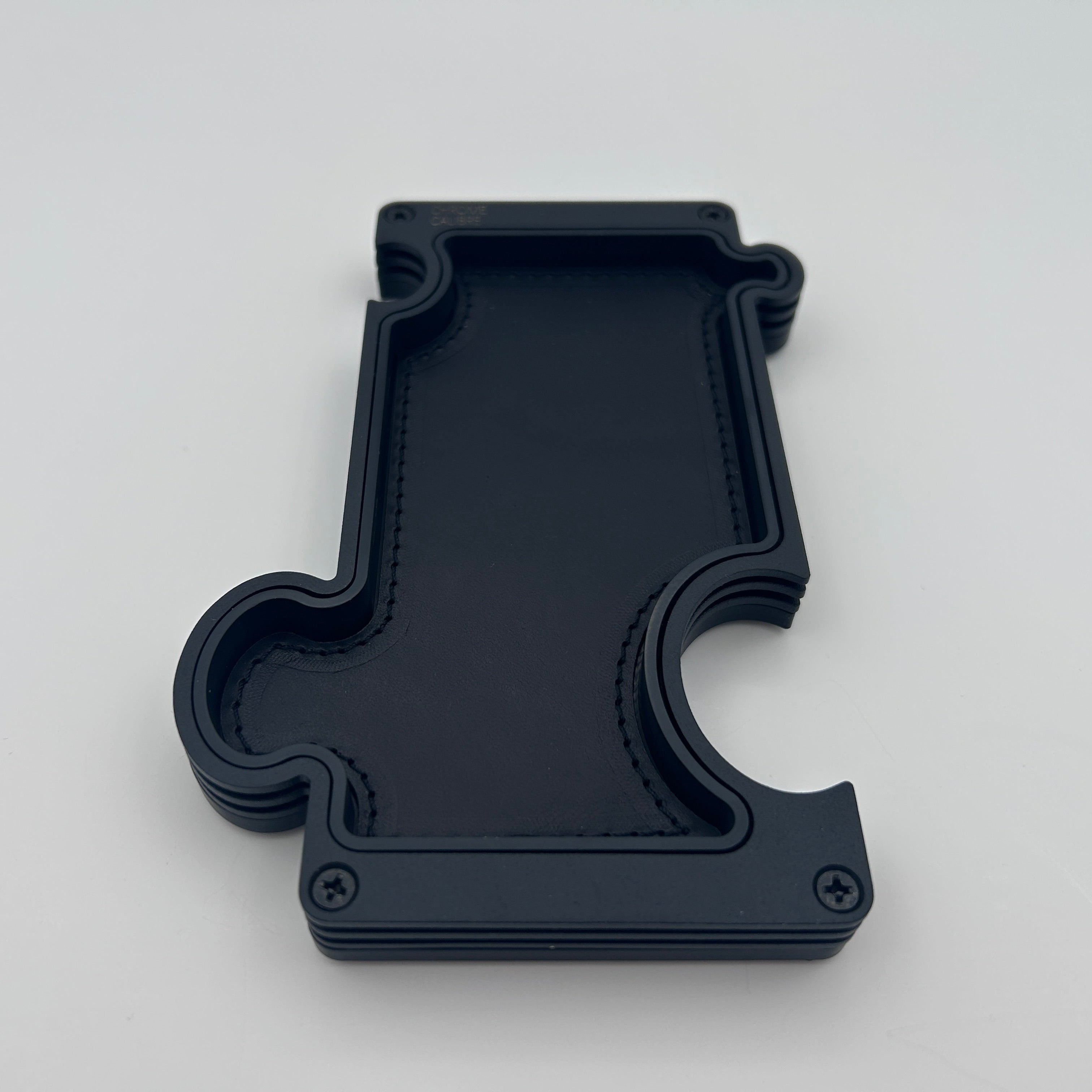 Puzzle Vanity Tray in layered black steel with black leather insert