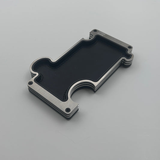 Brushed steel vanity tray with black leather insert on white background