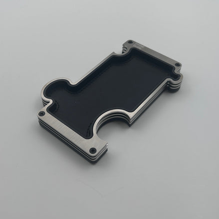Brushed steel vanity tray with black leather insert on white background