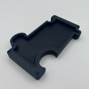 Vanity Tray with Puzzle design in black layered steel and black leather insert on white background