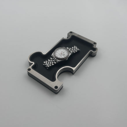 Steel vanity tray with watch on white background
