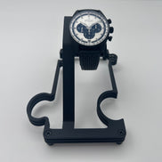 Black metal watch stand with Black zenith watch on white background