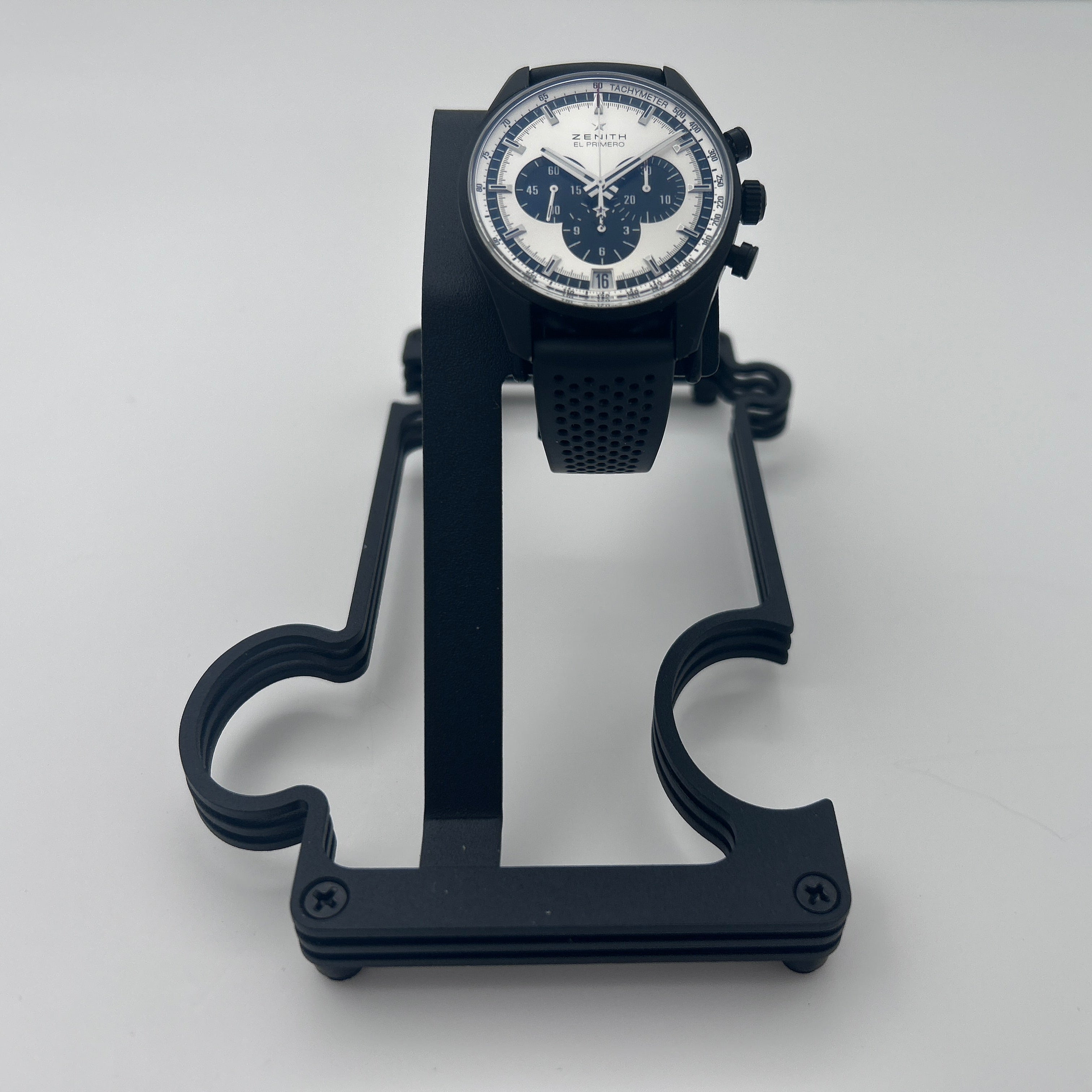 Black metal watch stand with Black zenith watch on white background