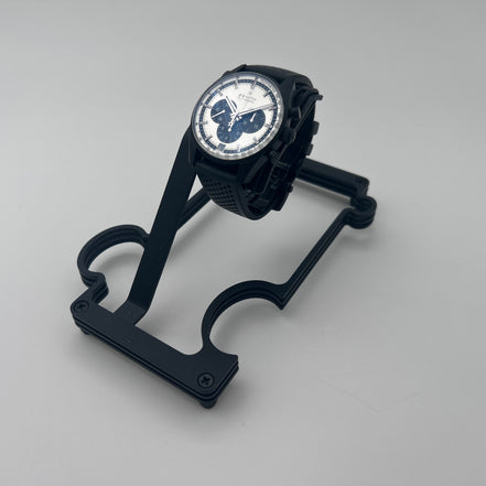 Black Metal stand with watch on white background