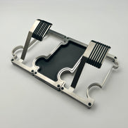2 metal watch stands interlinked on either side of a vanity tray on a white background