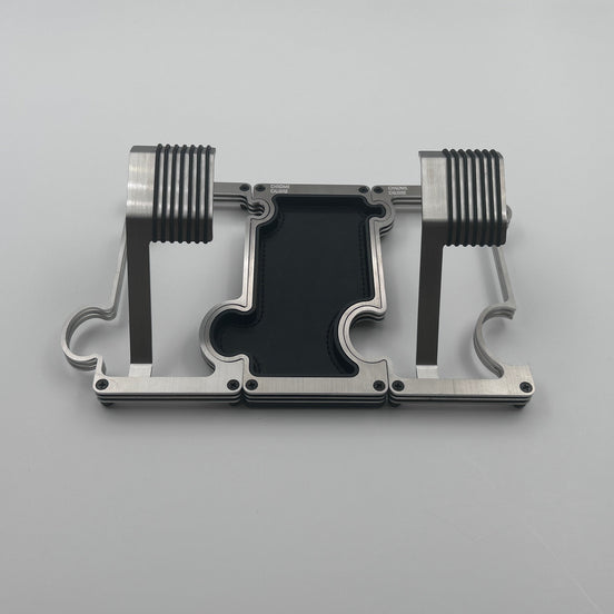2 metal watch stands with a vanity tray between them in brushed steel with a white background