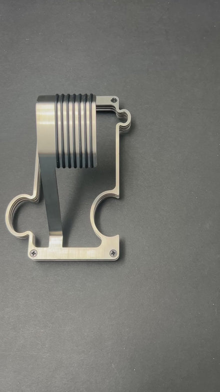 video of puzzle watch stand on grey surface showing the interlocking feature and adding a second stand